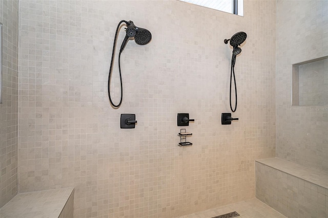 bathroom with a tile shower