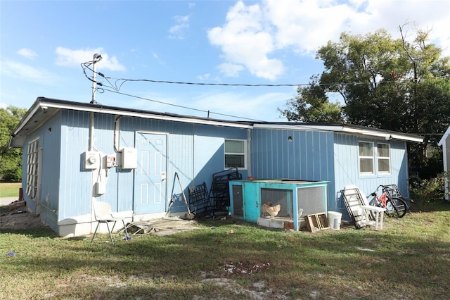 view of outbuilding with a yard