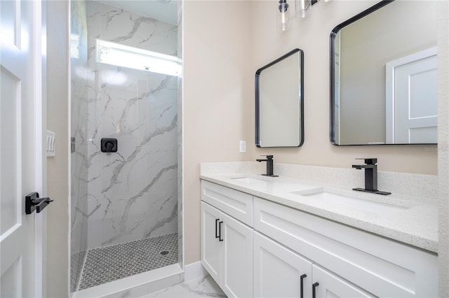 bathroom with vanity and tiled shower