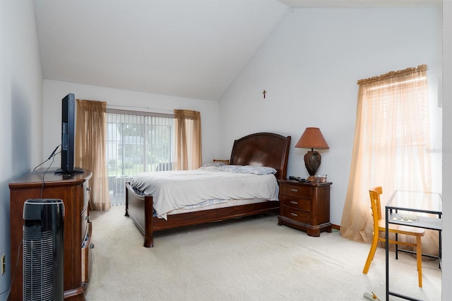 carpeted bedroom featuring multiple windows and high vaulted ceiling