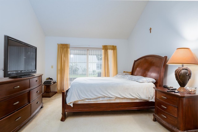 carpeted bedroom featuring lofted ceiling