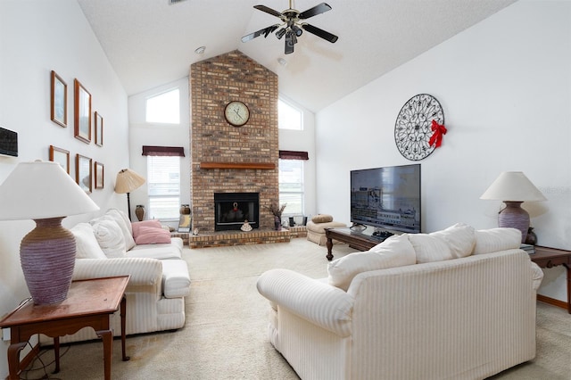 carpeted living room with ceiling fan, a fireplace, and high vaulted ceiling