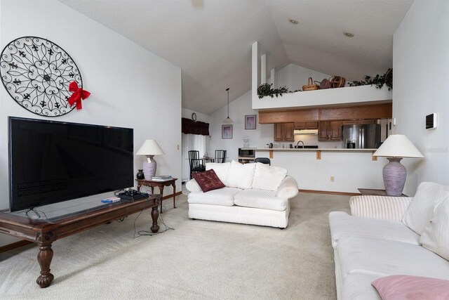 living room with light carpet, lofted ceiling, and sink