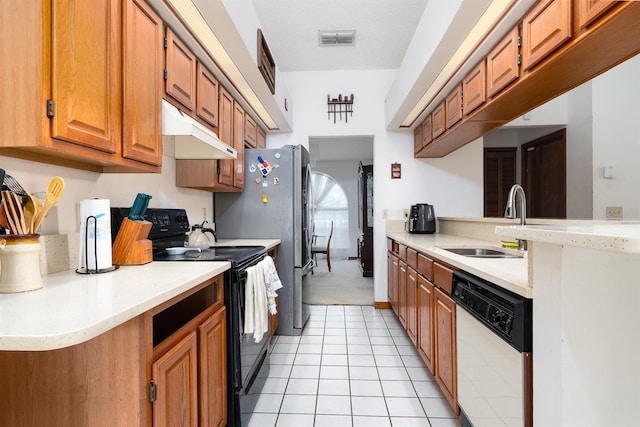 kitchen featuring a textured ceiling, sink, dishwasher, black / electric stove, and light tile patterned flooring