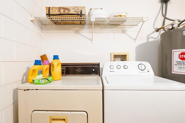 laundry area with independent washer and dryer