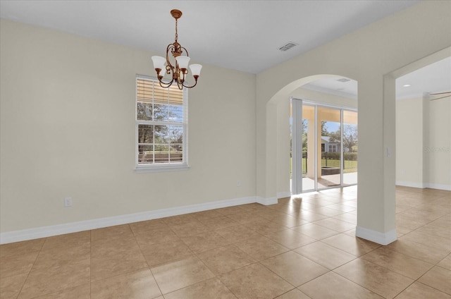 19206 Robertson St, Orlando, FL 32833 - tiled spare room with arched walkways, a chandelier, and crown molding