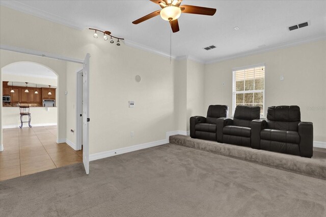 19206 Robertson St, Orlando, FL 32833 - cinema room with ceiling fan, ornamental molding, light carpet, and arched walkways