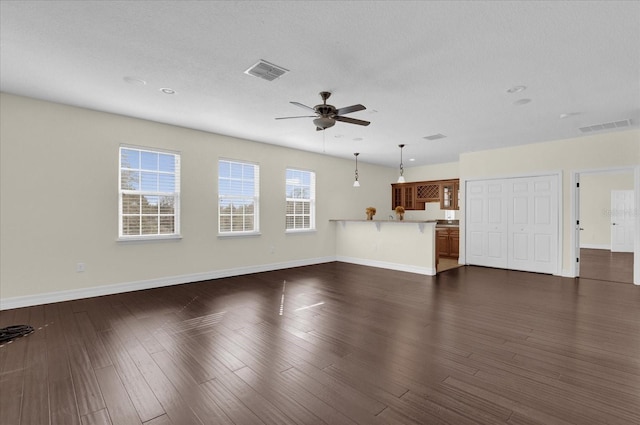 19206 Robertson St, Orlando, FL 32833 - unfurnished living room with ceiling fan, dark wood-type flooring, and recessed lighting