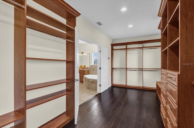 19206 Robertson St, Orlando, FL 32833 - walk in closet featuring dark wood finished floors