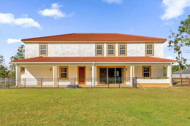 19206 Robertson St, Orlando, FL 32833 - back of property with a tiled roof, stucco siding, and a patio