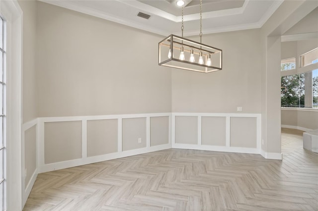 unfurnished dining area featuring an inviting chandelier, light parquet floors, a tray ceiling, and ornamental molding