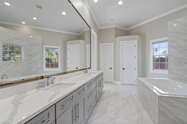 bathroom with tiled bath, vanity, and ornamental molding