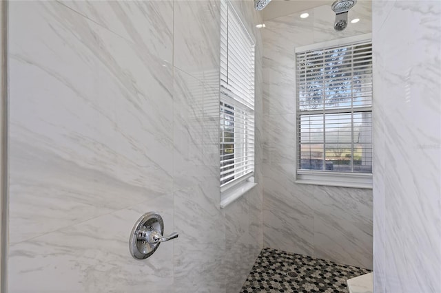 bathroom with tiled shower