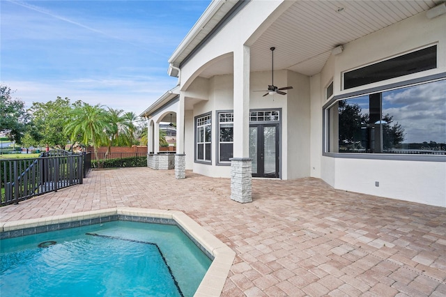 view of pool with a patio area and ceiling fan