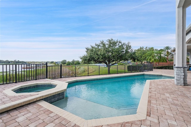 view of swimming pool with an in ground hot tub and a patio