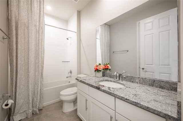 full bathroom featuring tile patterned flooring, vanity, toilet, and shower / tub combo