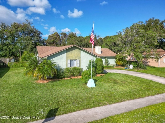 view of side of home featuring a yard