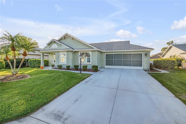 ranch-style home with a garage and a front yard