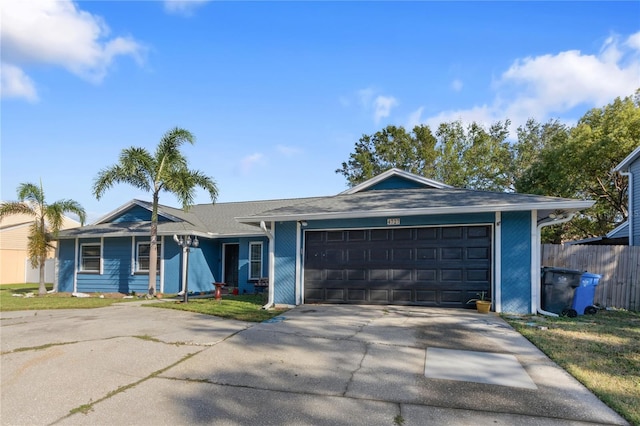 single story home with a garage