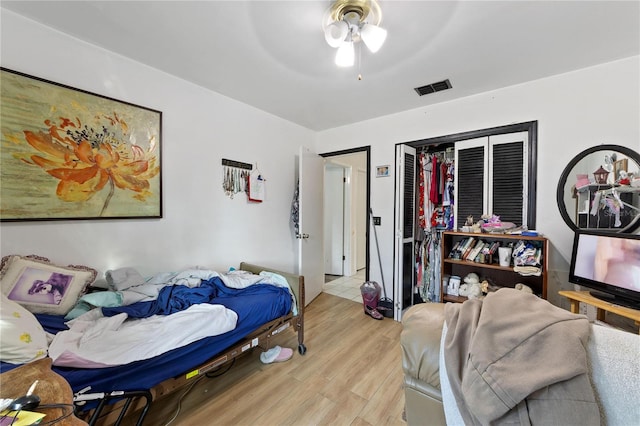 bedroom featuring ceiling fan and light hardwood / wood-style floors