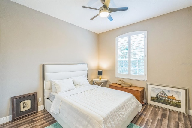 bedroom featuring dark hardwood / wood-style flooring and ceiling fan