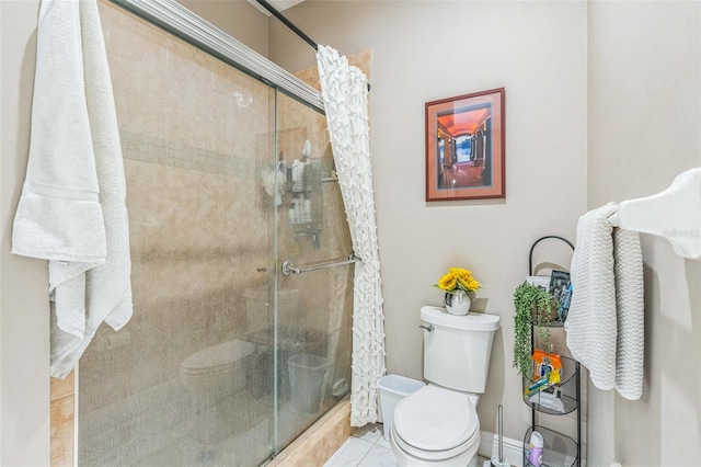 bathroom featuring toilet, tile patterned floors, and a shower with door