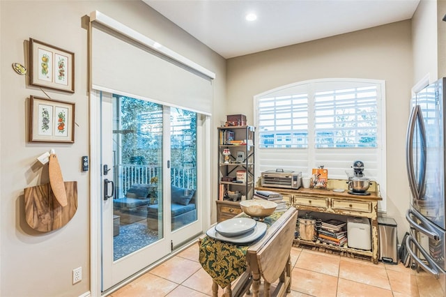 interior space featuring a healthy amount of sunlight and light tile patterned flooring