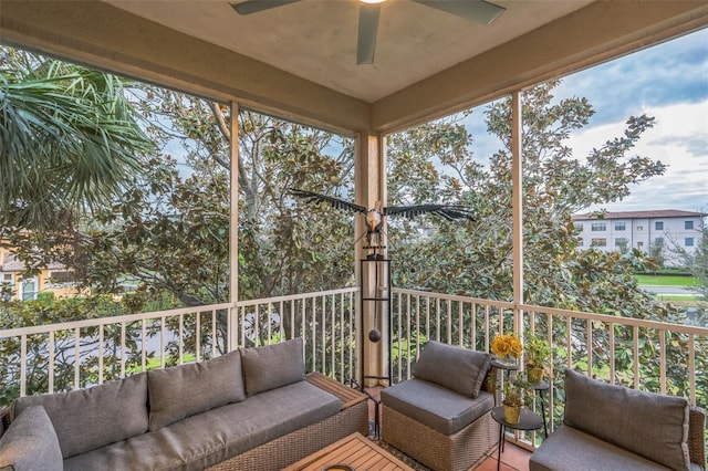 sunroom / solarium with a ceiling fan