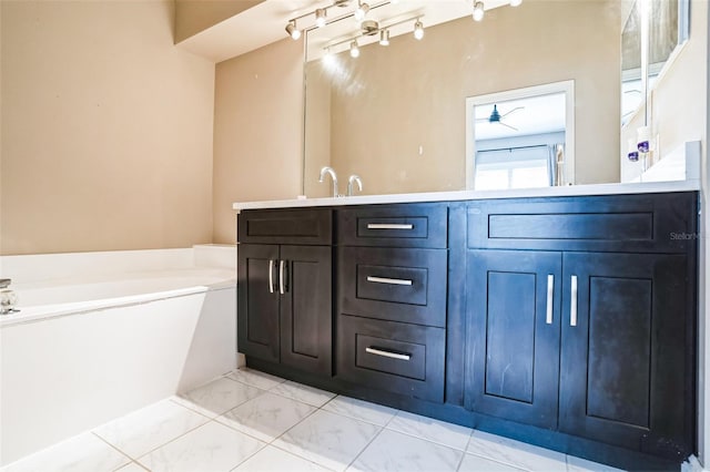7700 Carriage Homes Dr Unit 4, Orlando, FL 32819 - bathroom with double vanity, marble finish floor, and a bath