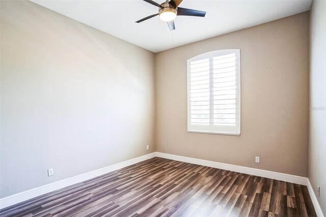 7700 Carriage Homes Dr Unit 4, Orlando, FL 32819 - unfurnished room featuring dark wood finished floors, baseboards, and a ceiling fan
