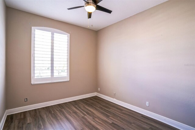7700 Carriage Homes Dr Unit 4, Orlando, FL 32819 - spare room featuring dark wood-style floors, baseboards, and ceiling fan