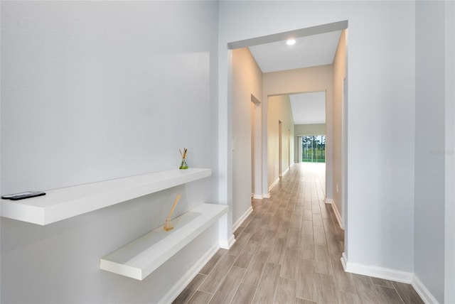 corridor featuring light hardwood / wood-style floors