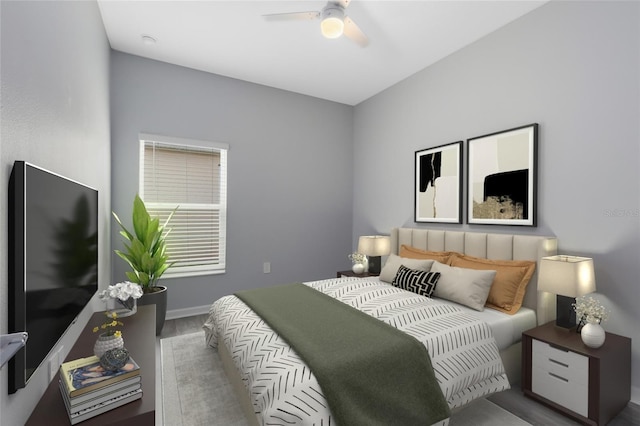 bedroom with hardwood / wood-style floors and ceiling fan