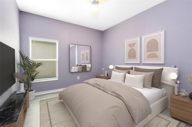 bedroom featuring light hardwood / wood-style flooring and ceiling fan