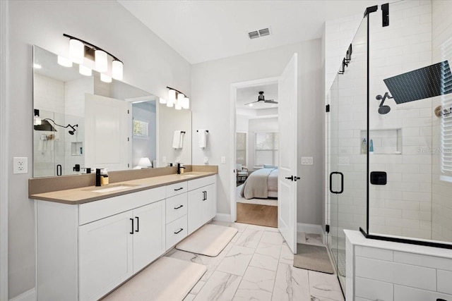 bathroom with walk in shower, vanity, and ceiling fan