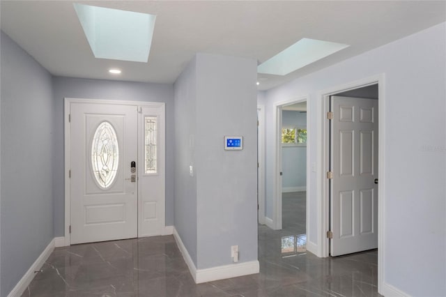 entrance foyer featuring a skylight