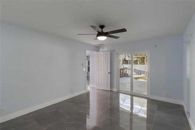 unfurnished room with ceiling fan