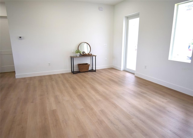 spare room featuring light wood-type flooring