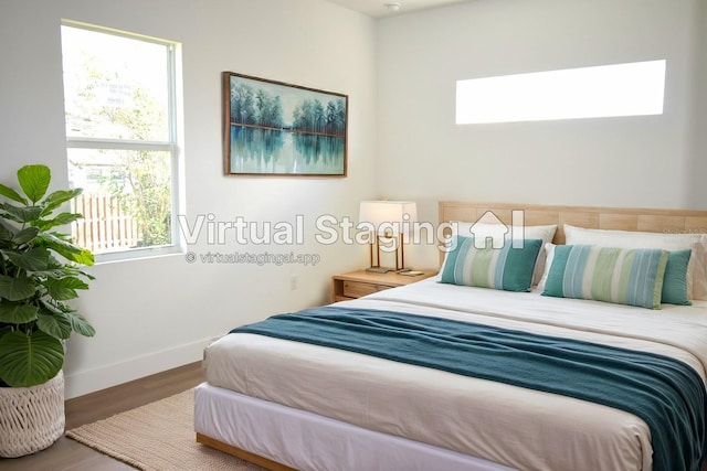 bedroom with hardwood / wood-style floors