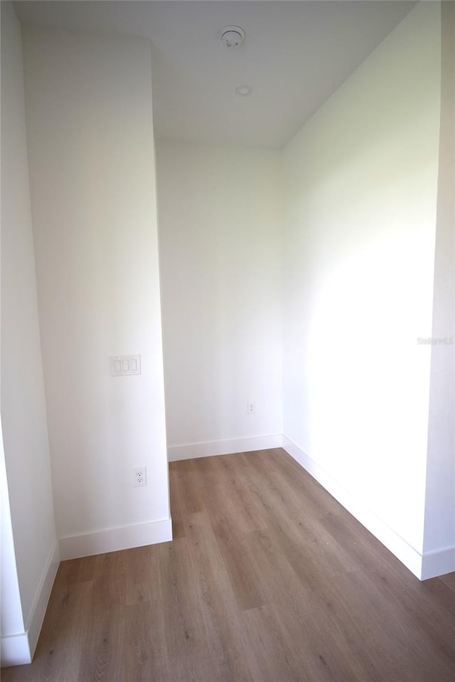 spare room with hardwood / wood-style floors