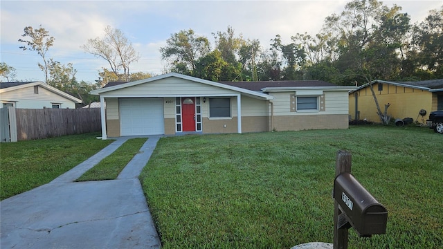 single story home featuring a front yard and a garage