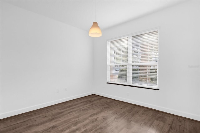 spare room with hardwood / wood-style flooring