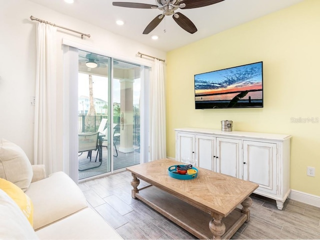 living room with wood finish floors, ceiling fan, baseboards, and recessed lighting