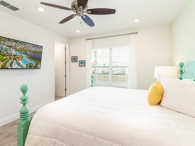 bedroom featuring baseboards, visible vents, and recessed lighting