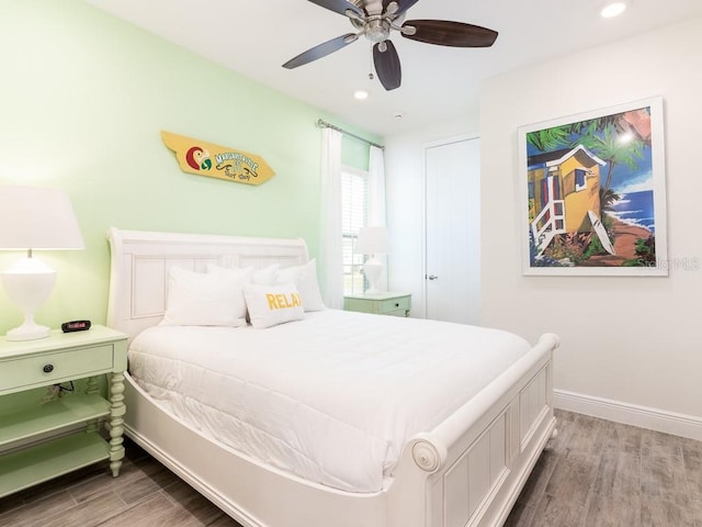 bedroom featuring wood-type flooring and ceiling fan