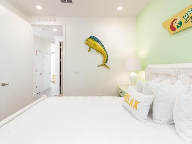 bedroom with visible vents and recessed lighting