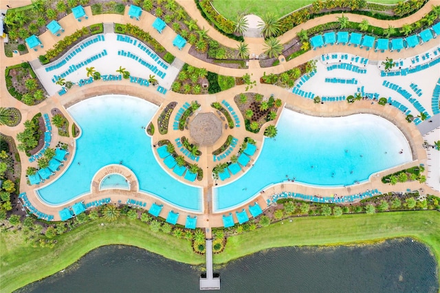 birds eye view of property with a water view