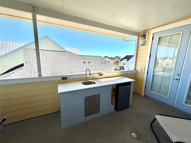 view of patio / terrace featuring french doors and sink