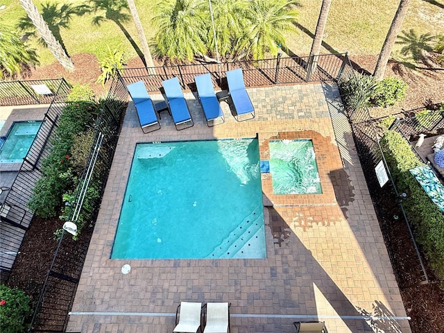 view of swimming pool with fence