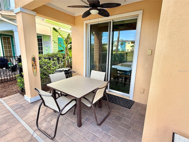 view of patio with ceiling fan and outdoor dining space